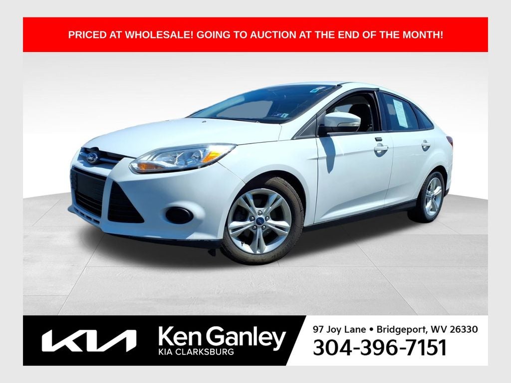 2014 Ford Focus SE in Oxford White — front three-quarter view